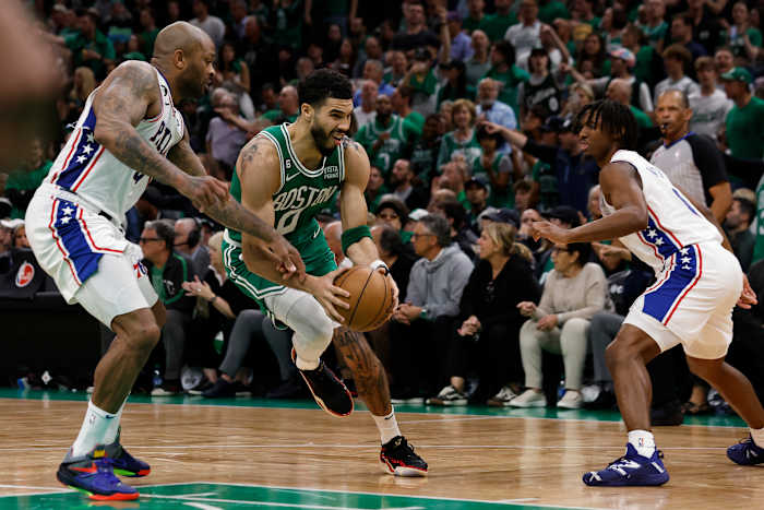 Philadelphia 76ers forward P.J. Tucker defends Boston Celtics forward Jayson Tatum.